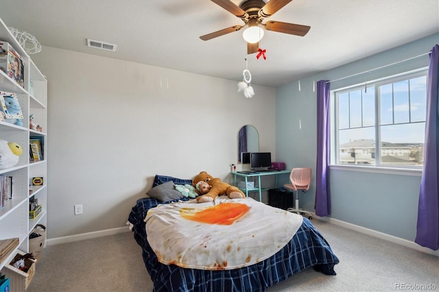 bedroom with a ceiling fan, baseboards, visible vents, and carpet flooring