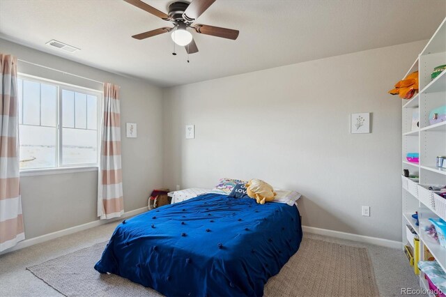 bedroom featuring baseboards, visible vents, a ceiling fan, and carpet flooring