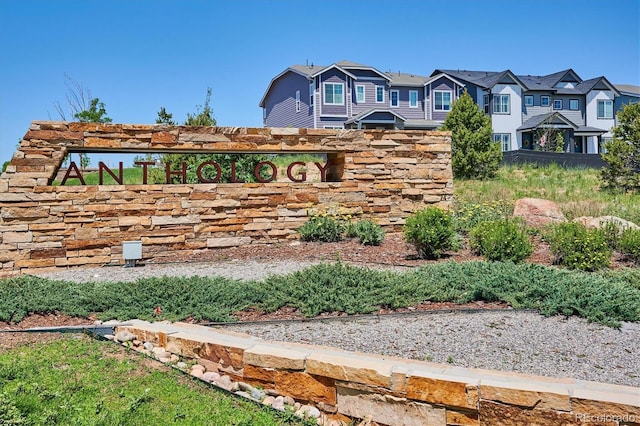 community / neighborhood sign featuring a residential view