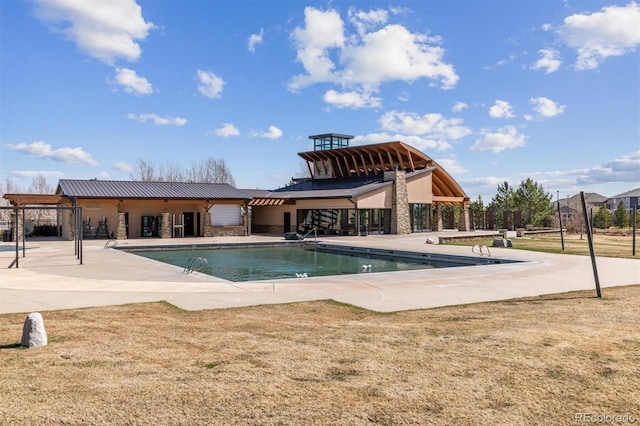 community pool featuring a patio area