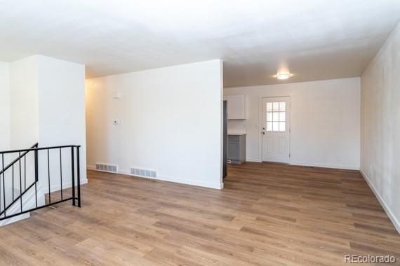 unfurnished room featuring light hardwood / wood-style floors