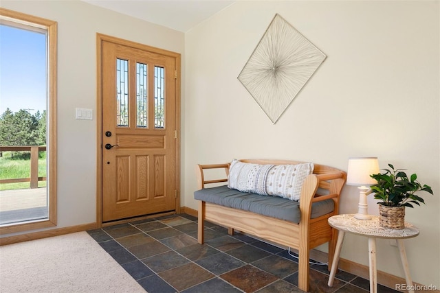 713 Aspen Rd, Golden, CO 80401 - foyer with baseboards and dark stone finish flooring