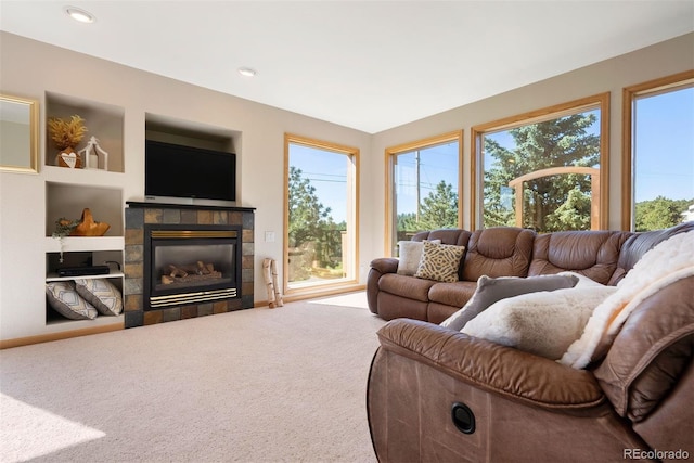 713 Aspen Rd, Golden, CO 80401 - living room with healthy amount of natural light, carpet floors, a fireplace, built in shelves, and recessed lighting