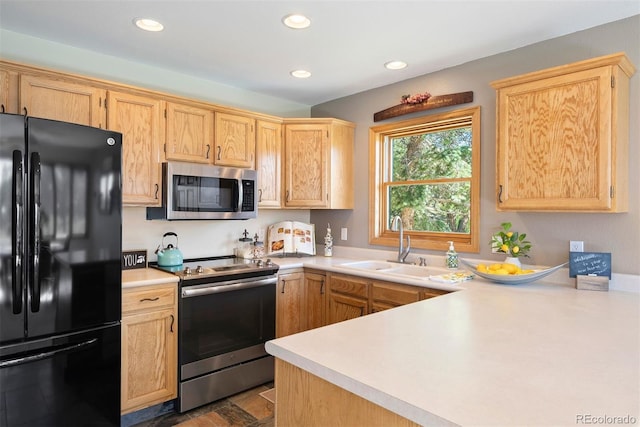 713 Aspen Rd, Golden, CO 80401 - kitchen with stainless steel appliances, light countertops, recessed lighting, and light brown cabinetry