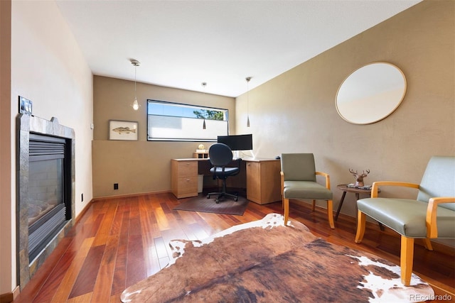 713 Aspen Rd, Golden, CO 80401 - office space featuring wood-type flooring and a tile fireplace