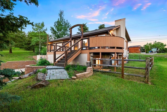713 Aspen Rd, Golden, CO 80401 - rear view of house with stairway, a deck, and stucco siding