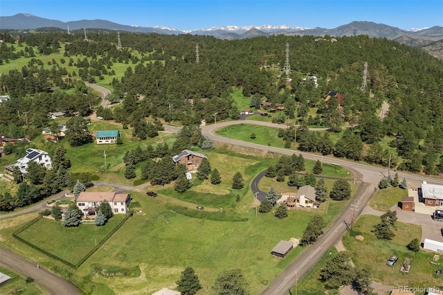 713 Aspen Rd, Golden, CO 80401 - aerial view of property's location featuring a mountainous background and a forest