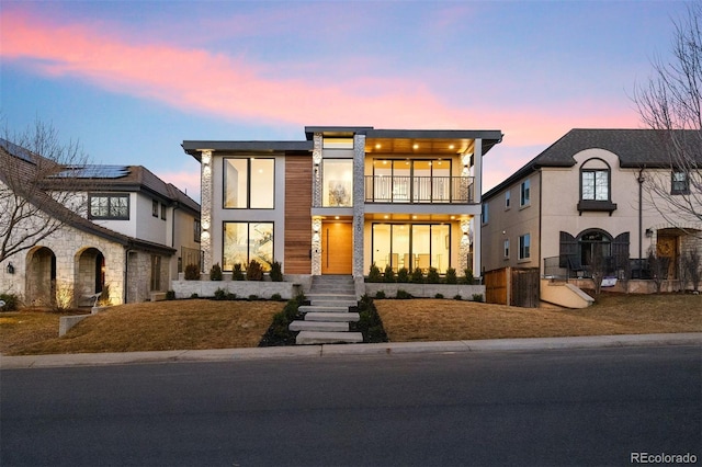 view of front of house with a balcony