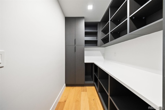 interior space with light wood-type flooring and baseboards