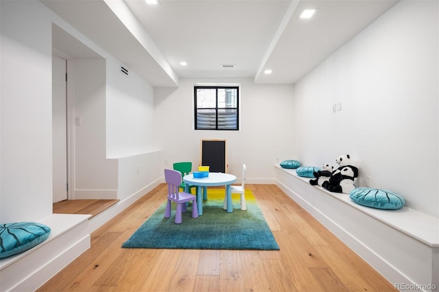 playroom with light wood finished floors, visible vents, baseboards, and recessed lighting