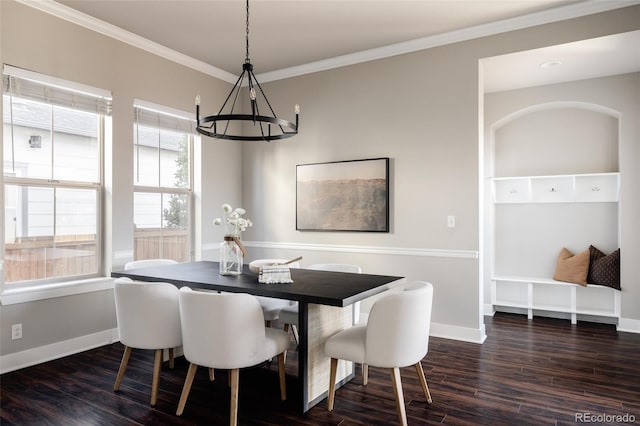 dining room with crown molding and dark wood-type flooring