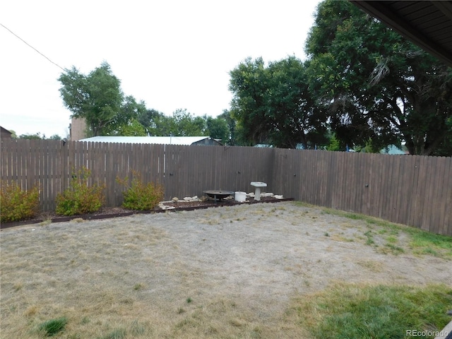 view of yard with a fenced backyard