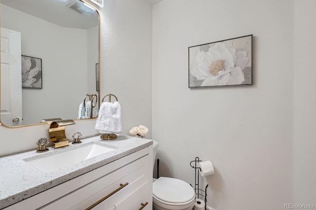 1179 S Fultondale Cir, Aurora, CO 80018 - half bathroom featuring vanity and toilet
