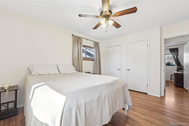 bedroom featuring hardwood / wood-style flooring and ceiling fan