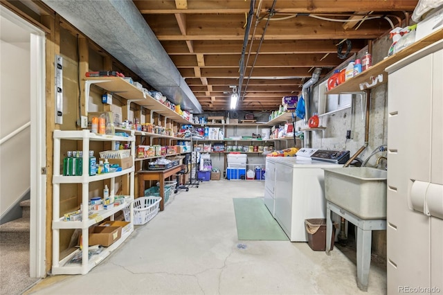 basement with sink and independent washer and dryer