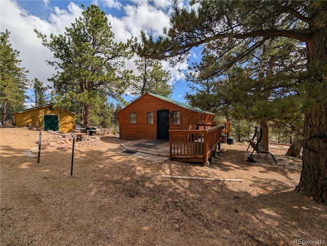 2117 Badger Creek Rd, Hartsel, CO 80449 - rear view of property featuring a wooden deck and an outbuilding