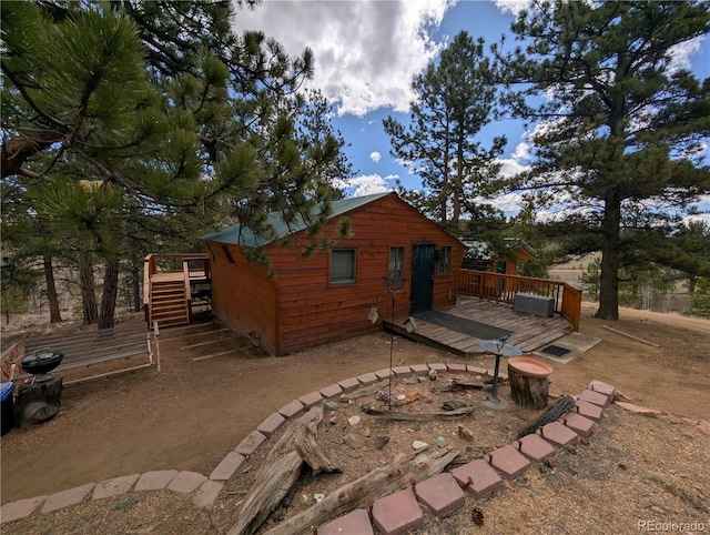 2117 Badger Creek Rd, Hartsel, CO 80449 - rear view of house with a deck and stairs