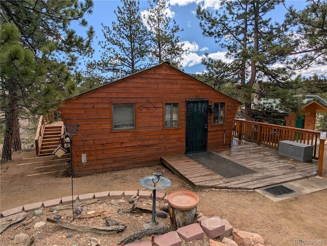 2117 Badger Creek Rd, Hartsel, CO 80449 - rear view of property featuring a wooden deck and stairway