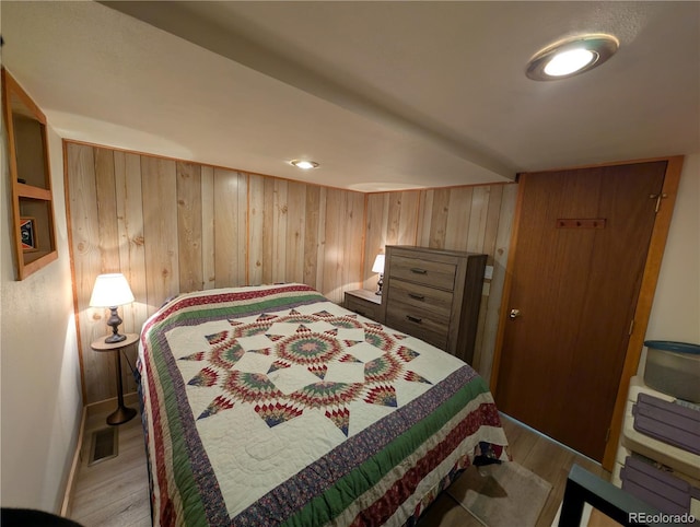 2117 Badger Creek Rd, Hartsel, CO 80449 - bedroom featuring wooden walls and wood finished floors