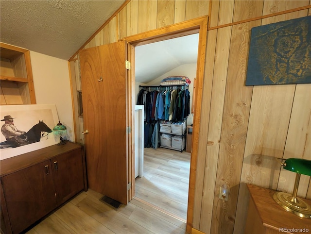 2117 Badger Creek Rd, Hartsel, CO 80449 - hall with vaulted ceiling, light wood-type flooring, and a textured ceiling