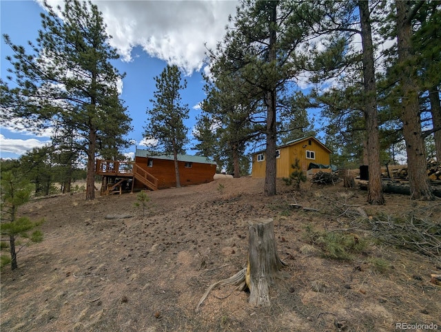 2117 Badger Creek Rd, Hartsel, CO 80449 - view of yard featuring a wooden deck and stairs