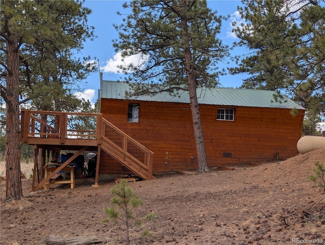 2117 Badger Creek Rd, Hartsel, CO 80449 - view of side of property featuring a wooden deck, stairs, and a metal roof