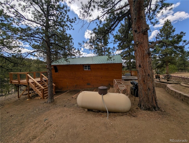 2117 Badger Creek Rd, Hartsel, CO 80449 - view of property exterior with a wooden deck and a metal roof
