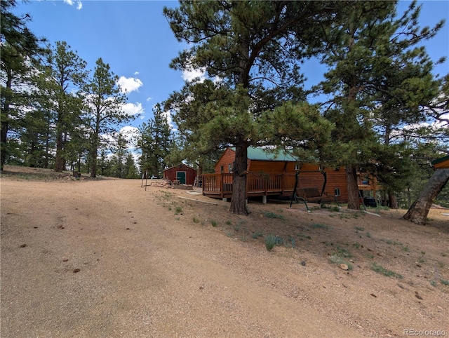 2117 Badger Creek Rd, Hartsel, CO 80449 - view of yard with a wooden deck and an outbuilding