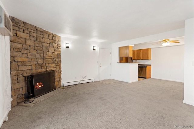 unfurnished living room with carpet, a wall mounted AC, a baseboard heating unit, ceiling fan, and a stone fireplace