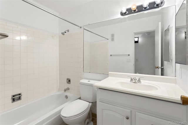 bathroom featuring washtub / shower combination, visible vents, vanity, and toilet