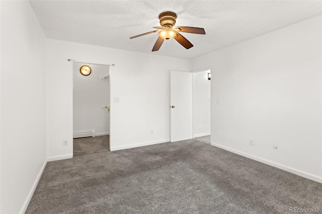 unfurnished bedroom with carpet, baseboards, baseboard heating, and a textured ceiling