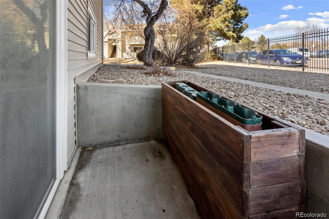 view of patio featuring fence