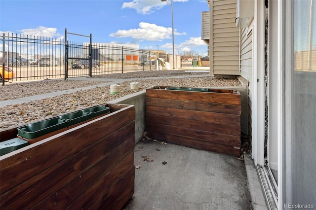 view of patio featuring fence