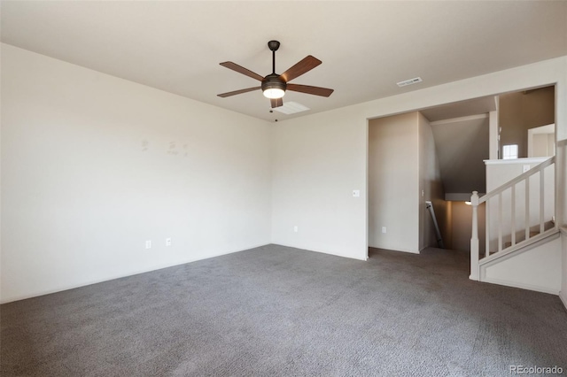 carpeted spare room with ceiling fan