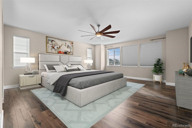 bedroom featuring ceiling fan and dark hardwood / wood-style flooring