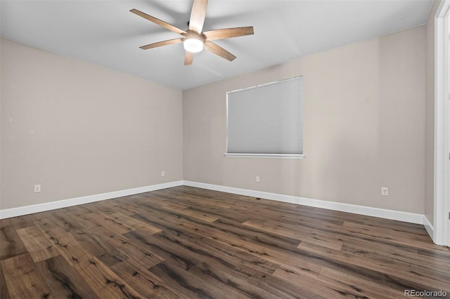 spare room featuring ceiling fan and dark hardwood / wood-style flooring