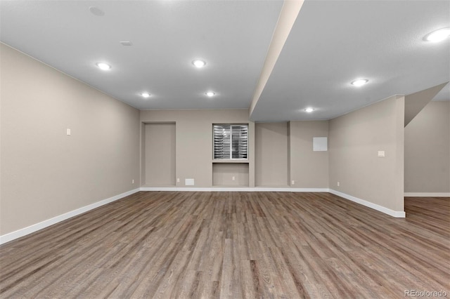 basement featuring hardwood / wood-style floors