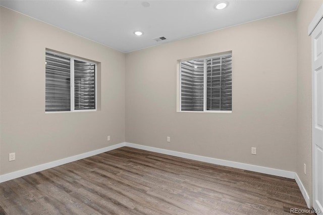 spare room featuring hardwood / wood-style floors