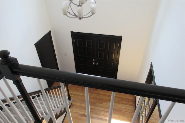 12381 E Vassar Dr, Aurora, CO 80014 - entrance foyer with a chandelier and wood finished floors
