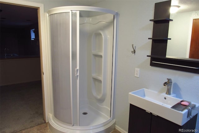 12381 E Vassar Dr, Aurora, CO 80014 - full bathroom featuring a shower stall and vanity