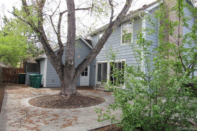 12381 E Vassar Dr, Aurora, CO 80014 - back of property featuring fence and a patio area