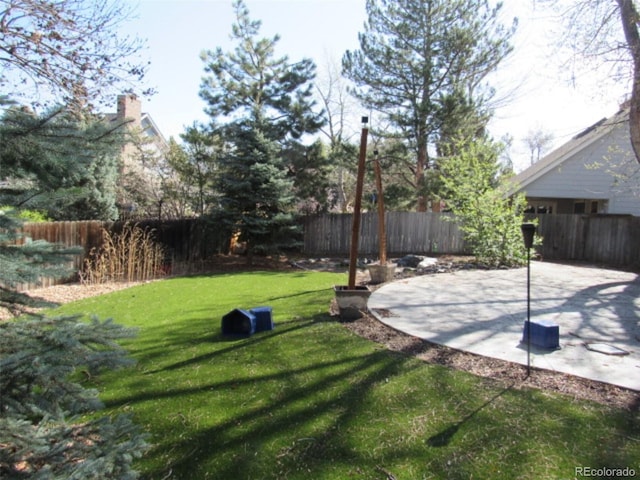 12381 E Vassar Dr, Aurora, CO 80014 - view of yard featuring a patio