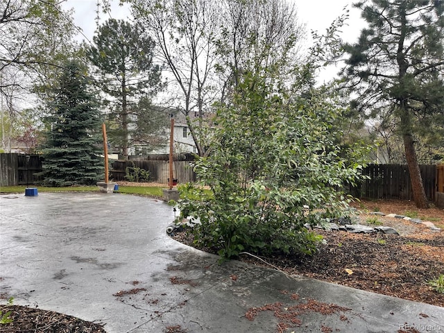12381 E Vassar Dr, Aurora, CO 80014 - view of side of home with a fenced backyard and a patio area