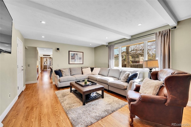 living room with light wood-style flooring, baseboards, beam ceiling, and recessed lighting