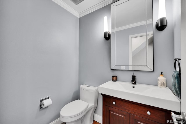 half bath featuring toilet, baseboards, ornamental molding, and vanity