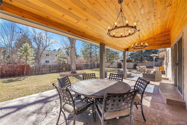 view of patio / terrace with outdoor dining space, a fenced backyard, and an outdoor living space