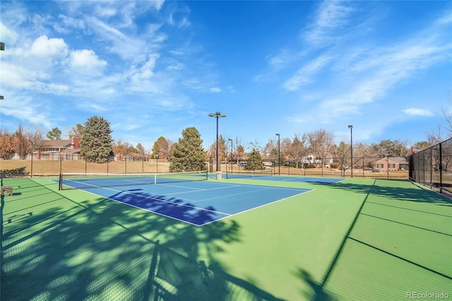 view of sport court with fence