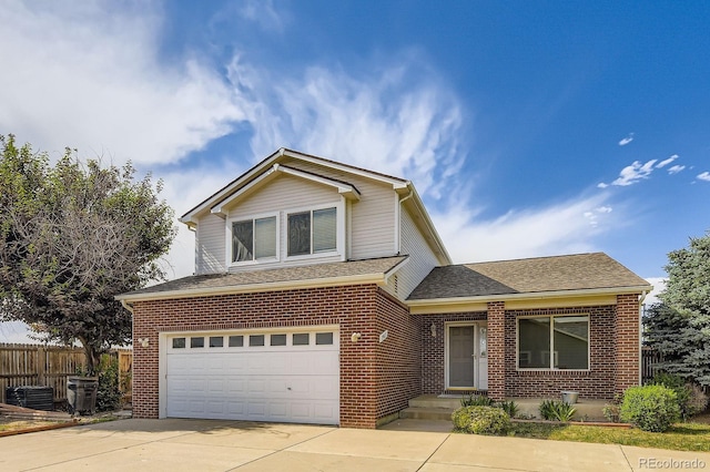 19033 E 22nd Cir, Aurora, CO 80011 - traditional-style house featuring driveway, brick siding, a garage, and a shingled roof