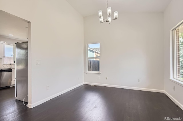 19033 E 22nd Cir, Aurora, CO 80011 - unfurnished dining area with dark wood finished floors and a chandelier