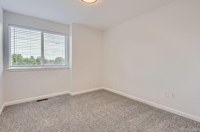19033 E 22nd Cir, Aurora, CO 80011 - empty room featuring carpet flooring and baseboards